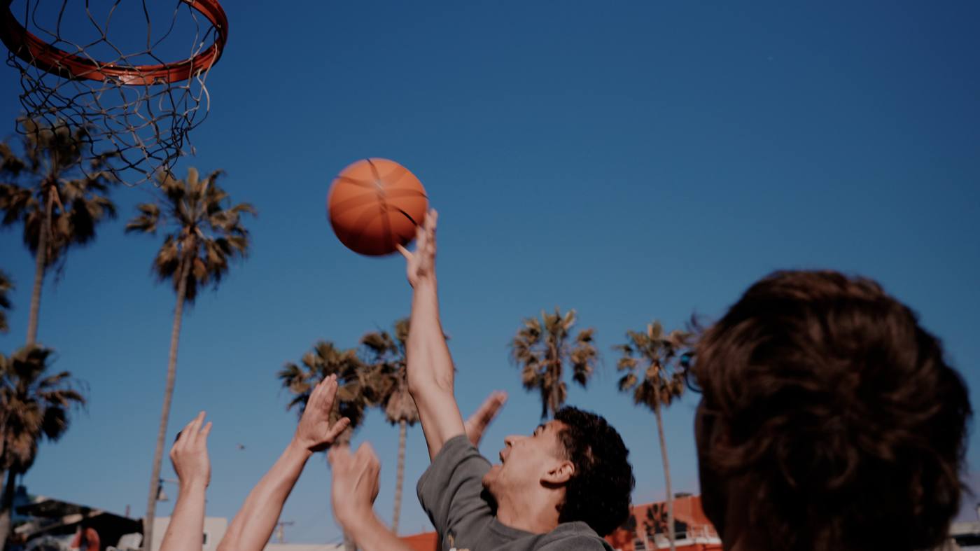 Players going for a shot at Venice Beach basketball court